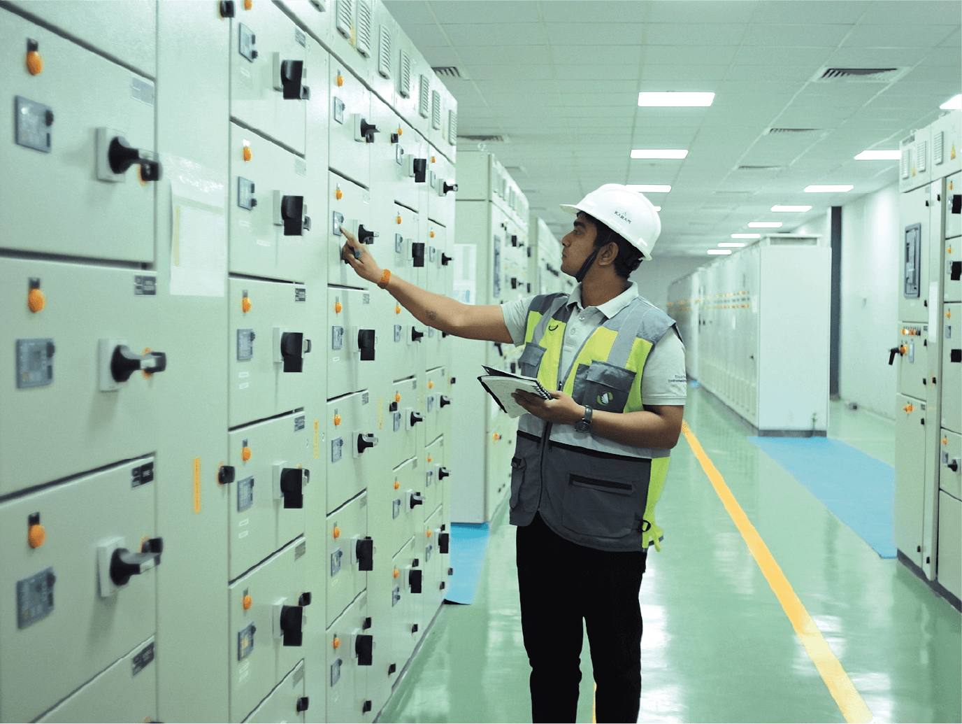 Naini team member checking control panels
