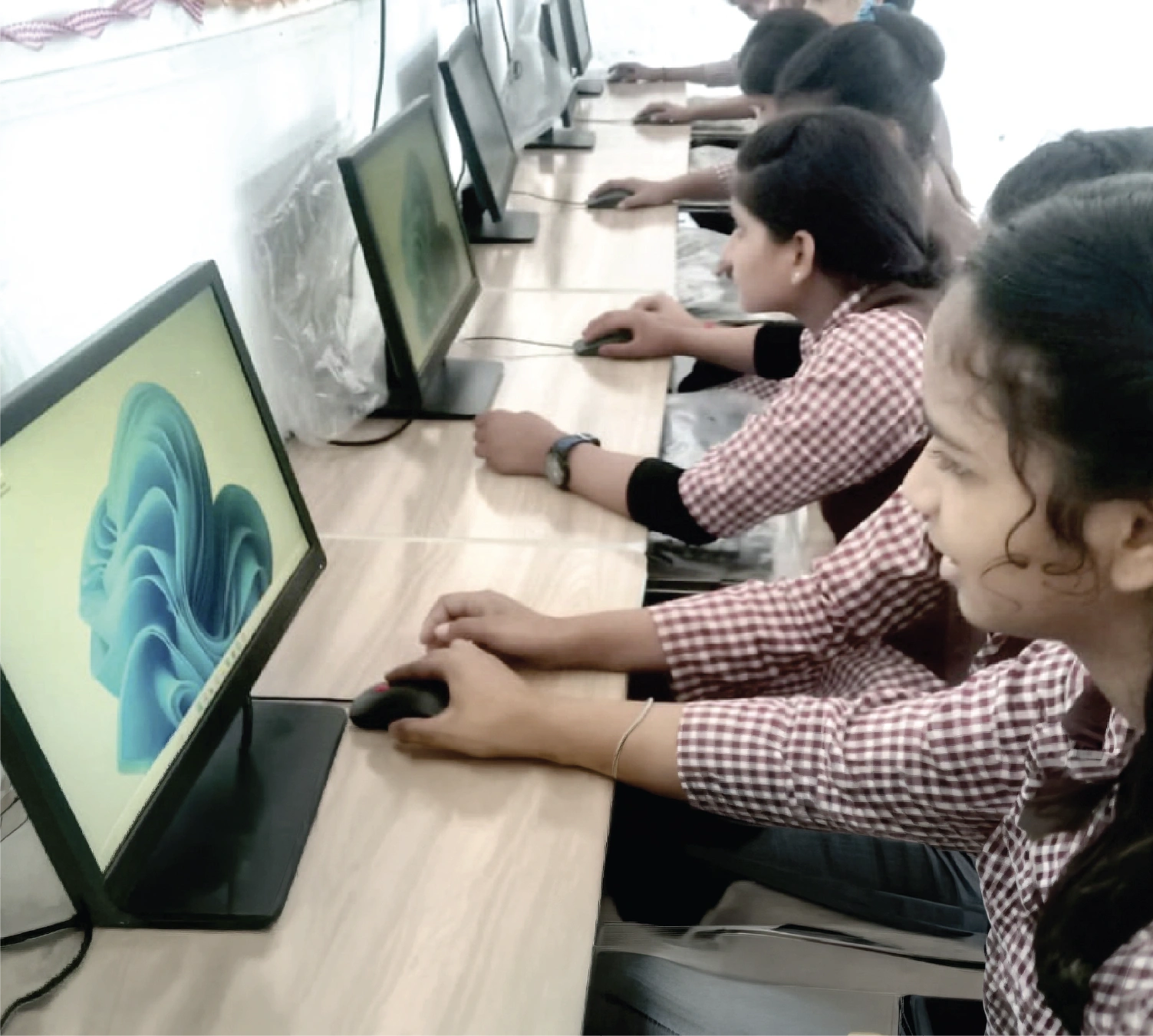 Students working at desktop computers